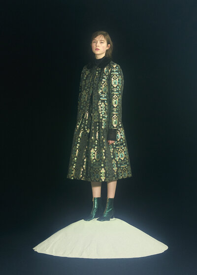 One of Minju Kim's designs Woman wearing a printed green dress