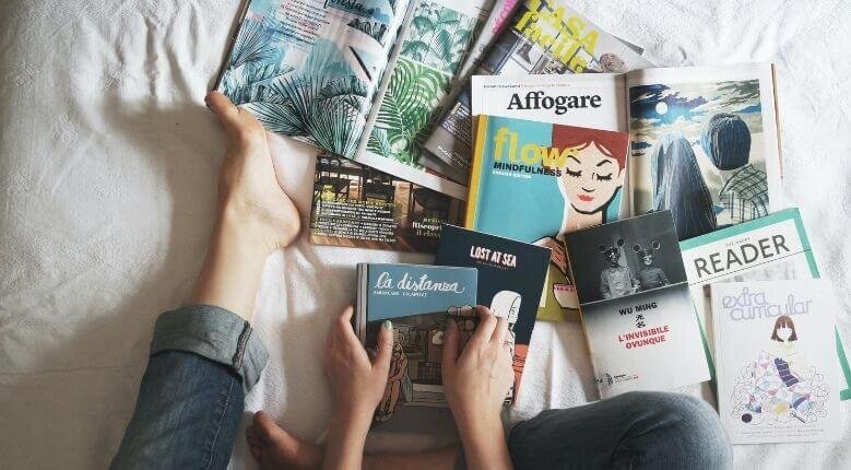 Girl with books and magazines flatlay Girl with books and magazines flatlay